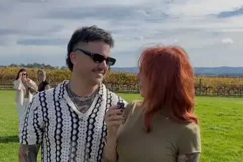 Guests enjoying wine among the vines